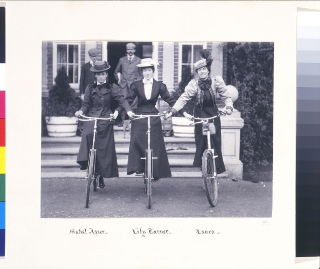 Women in dresses, on bicycles. Women in dresses, on bicycles.